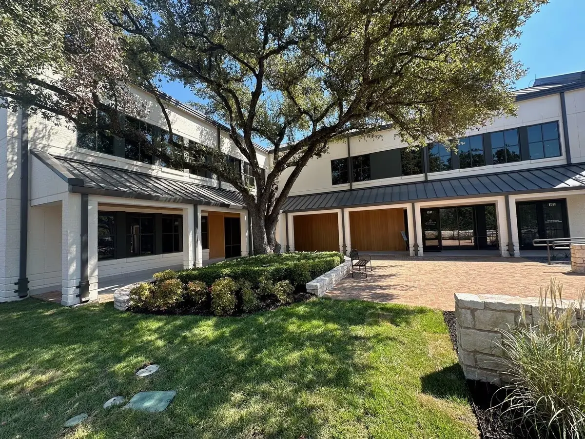 Street view of the stone and glass office building housing Victory Health & Wellness at 3811 Bee Caves Road, Suite 101, in West Lake Hills, Austin.