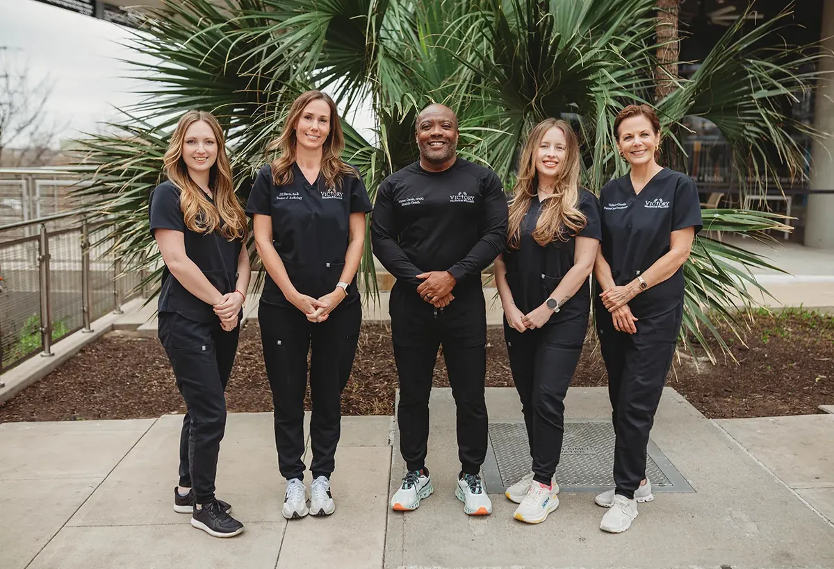 The Victory Hearing & Wellness team caring for a patient